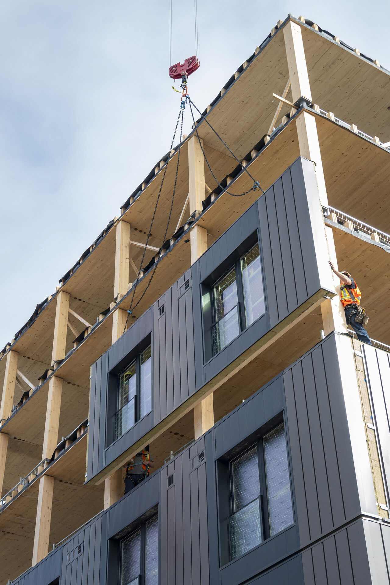 Prefabricated mass timber panel craned into place at Hälsa, Toronto